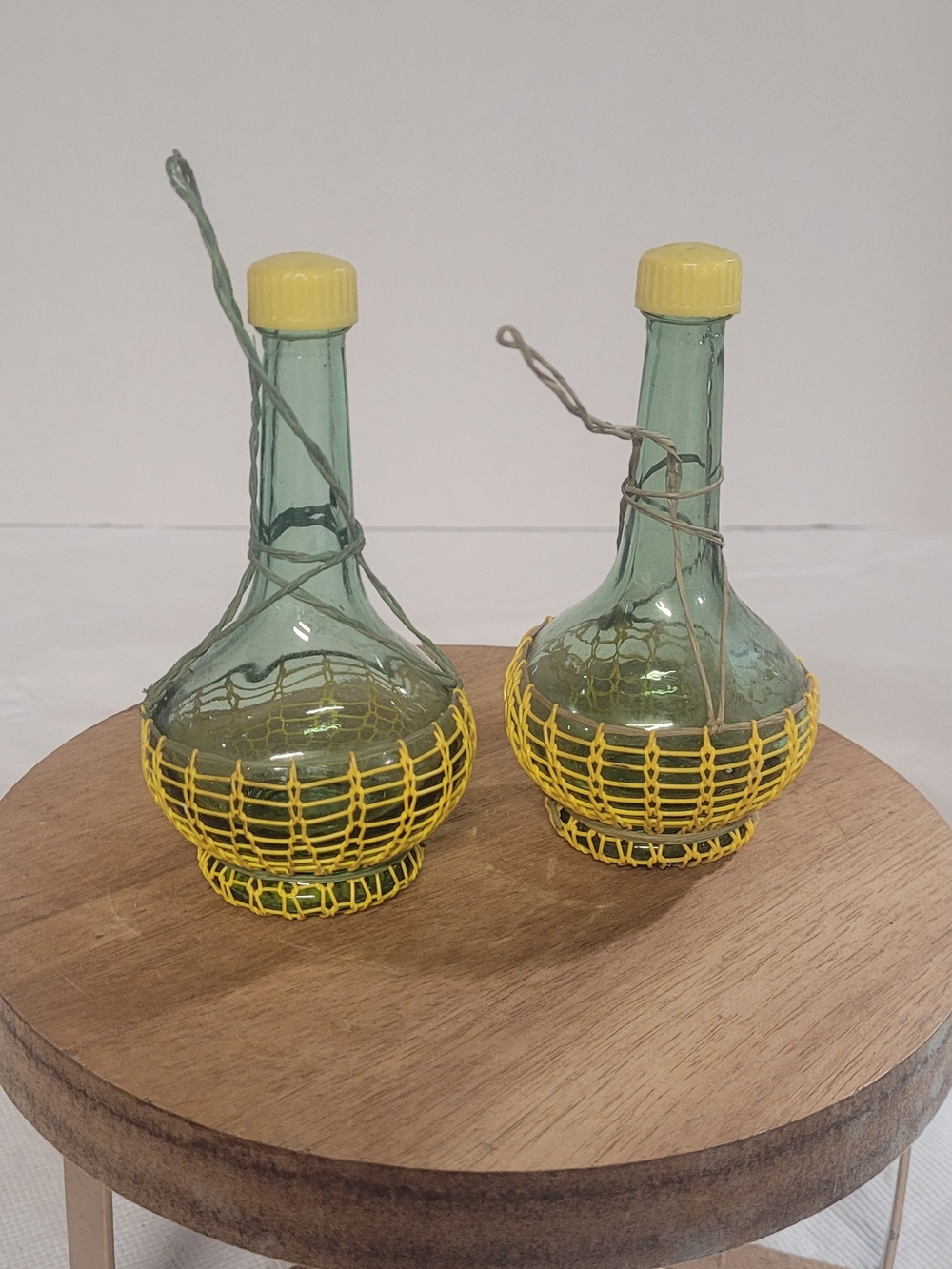 Vintage Italian Green Glass Salt & pepper Shakers with Yellow Woven Accents.